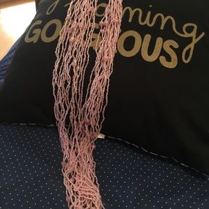 Pink beaded belt. 44 inches. 14 strands of beads.